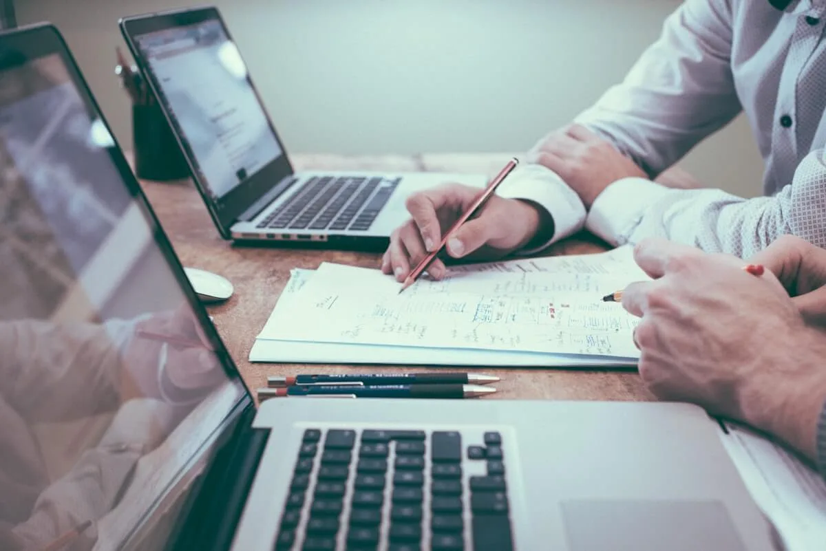 Person working at desk, overwhelmed by tasks