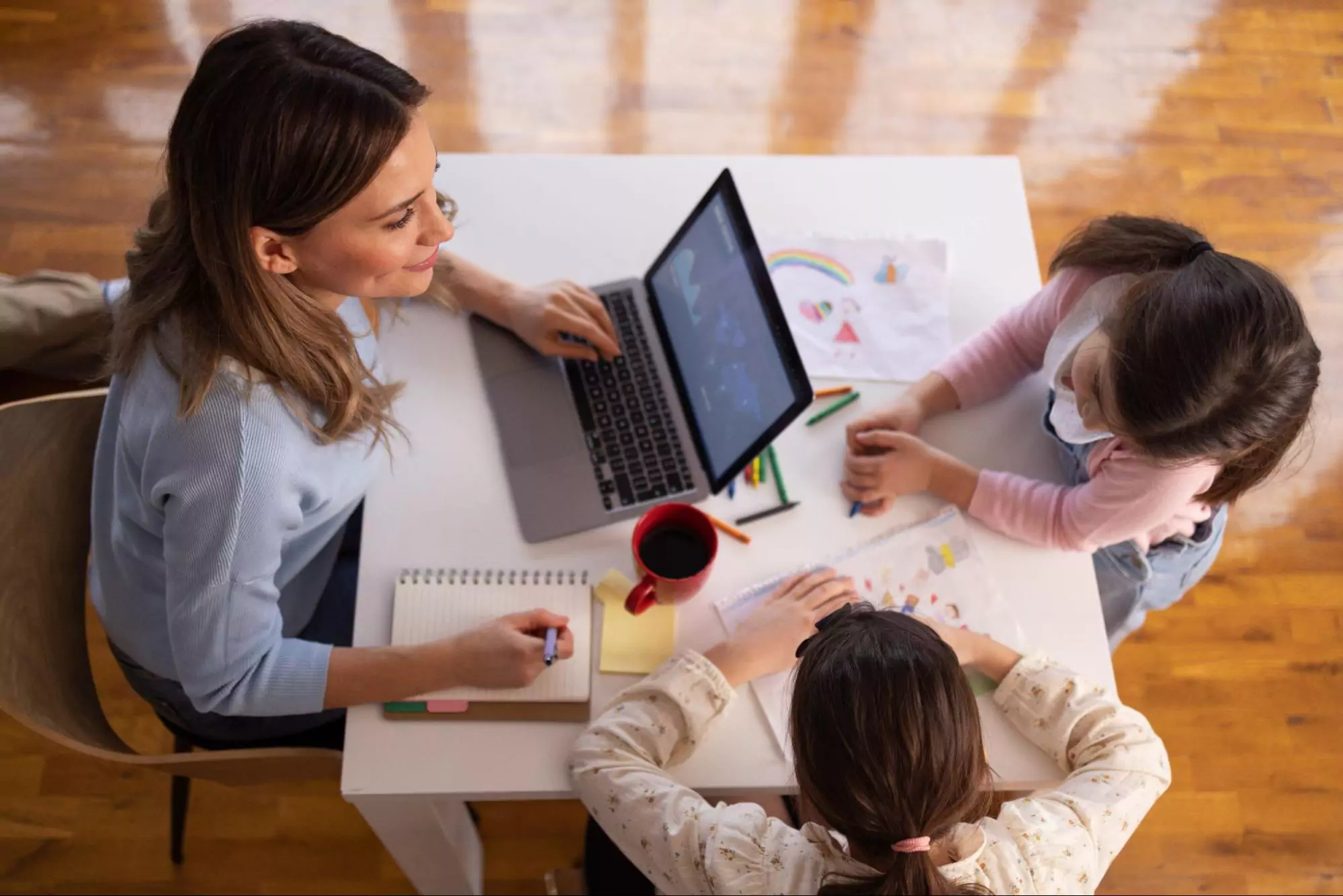 Entrepreneur spending quality time with kids while managing business tasks.