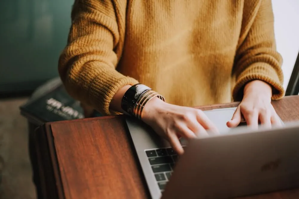 Person smiling while working productively on their phone
